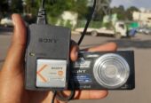Sony Cyber-shot DSC-W610 digital camera, a black compact model featuring a 14.1-megapixel sensor.